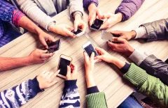 Group of people on their mobile phone